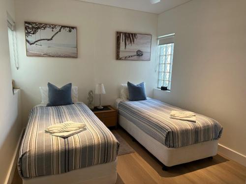 Ένα ή περισσότερα κρεβάτια σε δωμάτιο στο Cotton Beach Resort - Tweed Coast Holidays ®