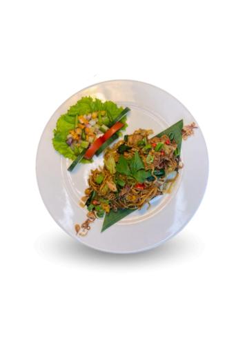 a plate of food with a salad on it at Vrata Hotel Yogyakarta in Kalasan