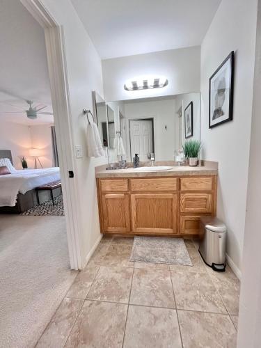 a bathroom with a sink and a bed at The Joshua Tree House in Joshua Tree