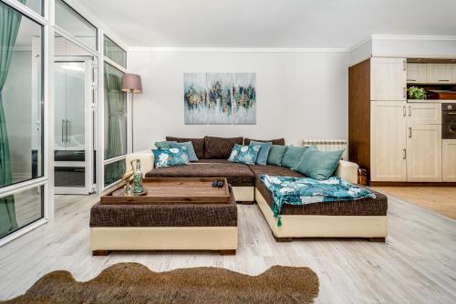 a living room with a couch and a table at French House in Belgrade