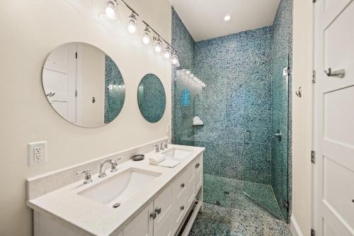 a bathroom with a sink and a shower at Endless Summer in Anna Maria