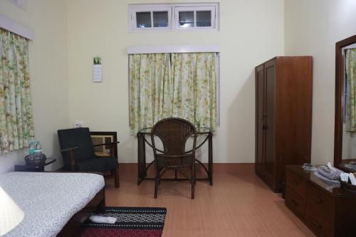Postel nebo postele na pokoji v ubytování Mancotta Heritage Chang Bungalow