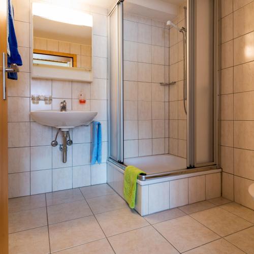 a bathroom with a shower and a sink at Christiania in Riederalp
