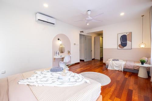 a living room with a table and a couch at Bungalow Putrajaya 15pax w Private Pool Gathering in Putrajaya