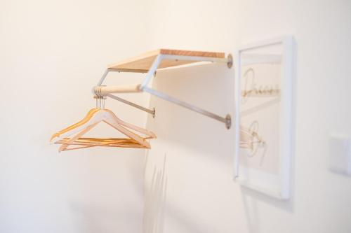 a couple of hangers in a refrigerator at Bungalow Putrajaya 15pax w Private Pool Gathering in Putrajaya
