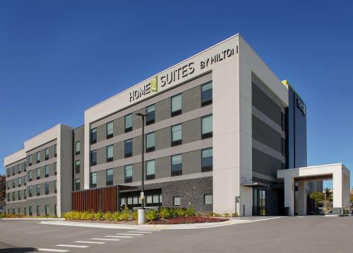 a large building with a sign on the side of it at Home2 Suites By Hilton Little Rock Midtown Medical Center in Little Rock
