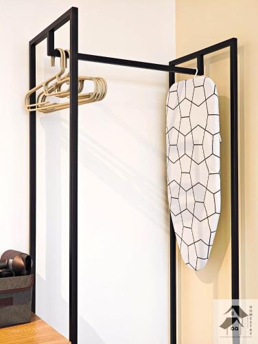 a sliding glass door with a tie hanging on a wall at Nilai-YouthCity-Uitm-Gembox-Lovely Stay-2r2b in Nilai