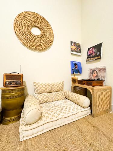 a living room with a couch and a table at Arabian-Inspired 1BR - Polo Residence Near Burj in Dubai