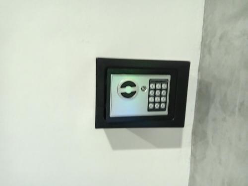 a wall mounted electrical outlet on a white wall at Lantacocogarden in Ko Lanta Yai