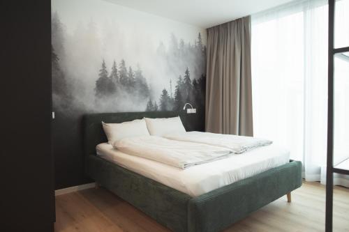 Postel nebo postele na pokoji v ubytování Black Forest Suites