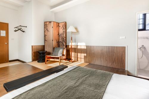 Giường trong phòng chung tại Jiufen Harmony Inn