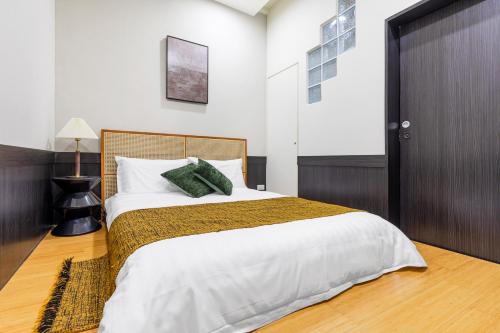 Giường trong phòng chung tại Jiufen Harmony Inn