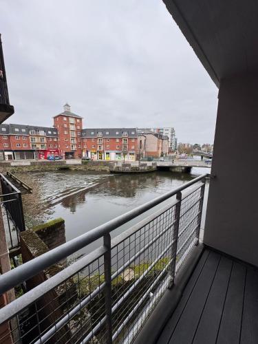 a view of a river from a balcony at Washington Street Apartment in Cork