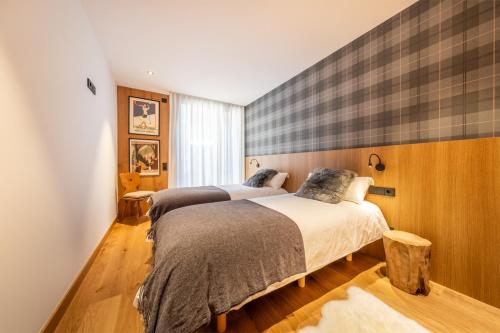 Ένα ή περισσότερα κρεβάτια σε δωμάτιο στο ISARD HOMES & SPA BY SELECT RENTALS