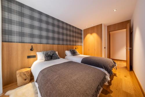 Ένα ή περισσότερα κρεβάτια σε δωμάτιο στο ISARD HOMES & SPA BY SELECT RENTALS