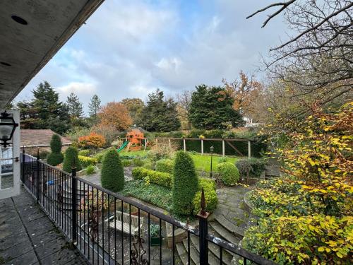 a view of a garden from a balcony at The Bishop in London