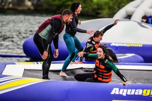 a group of people on surfboards in the water at The Old Bank Bruff Family Town House in Bruff
