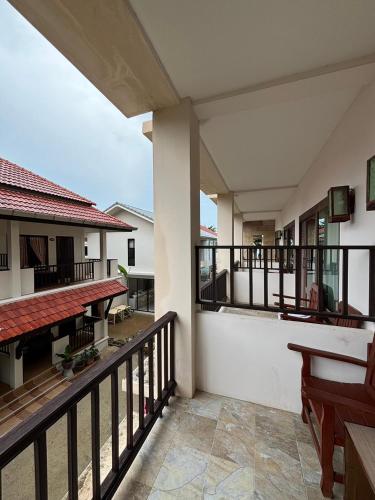 a balcony of a house with a view at Rin Bay View Resort in Haad Rin