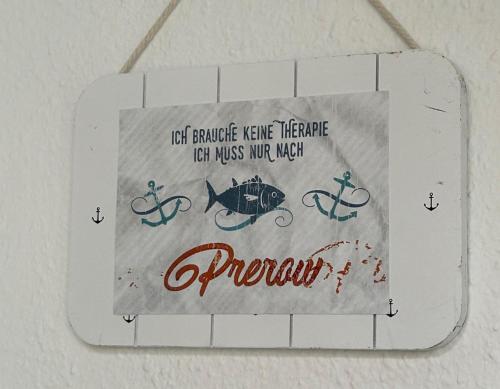 a picture of a sign with a fish and an anchor at Resi Q7 in Prerow