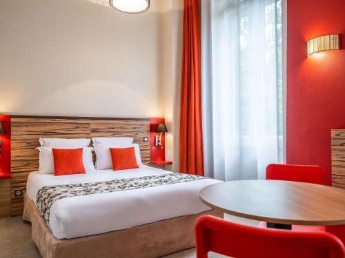 Postel nebo postele na pokoji v ubytování Aparthotel Adagio Lyon Patio Confluence