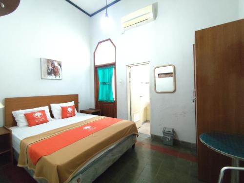 Katil atau katil-katil dalam bilik di Urban Guest House