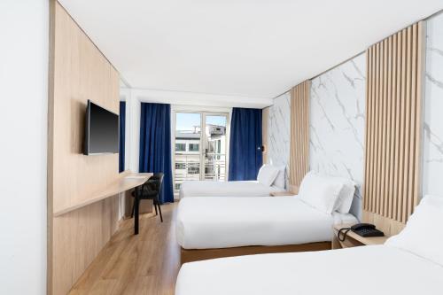 Un ou plusieurs lits dans un hébergement de l'établissement Rihab Hotel