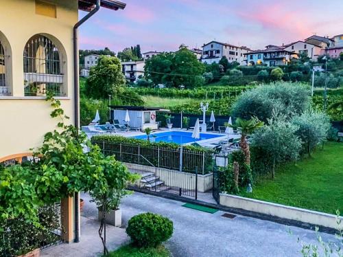 a view of a house with a swimming pool at Residence Garda Valtenesi in Puegnano del Garda