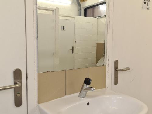 a bathroom with a sink and a mirror at Cabane forestière avec terrasse près de la base nautique - FR-1-591-644 in Pouligny-Notre-Dame