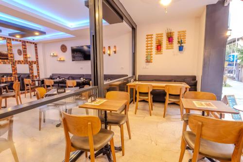 a restaurant with tables and chairs in a room at Ruby Hotel in Istanbul