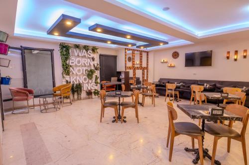 a restaurant with tables and chairs in a room at Ruby Hotel in Istanbul