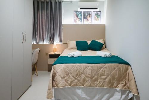 Ένα ή περισσότερα κρεβάτια σε δωμάτιο στο Apt Completo Próximo da Praia de Atalaia