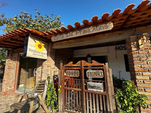 a store with a sign on the front of a building at Casa da praia Atins Maranhão in Atins