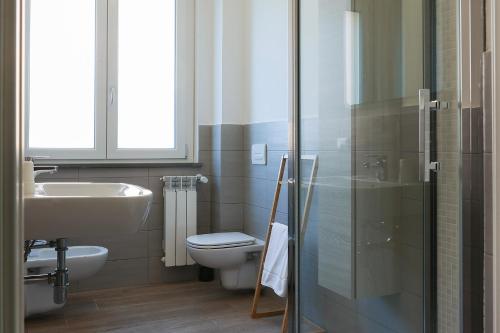 a bathroom with a toilet and a sink and a shower at Santa Caterina in Levanto