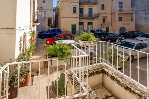 a group of cars parked in a parking lot at Antiche Mura Apartments"Cielo di Puglia" -2 matrimoniali, cucina e terrazzo in Turi