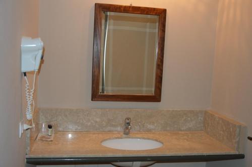 a bathroom with a sink and a mirror at Blue Dream Hotel in Monselice