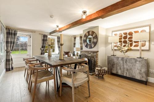 a dining room with a table and chairs at Great Easton Lodge in Great Easton