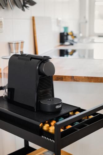 a microwave sitting on top of a table in a kitchen at Design-Apartments in der Braunauer Altstadt in Braunau am Inn