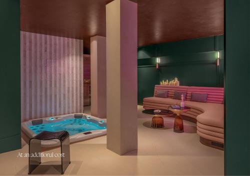 a rendering of a bathroom with a tub and a couch at Boudoir des Muses in Paris