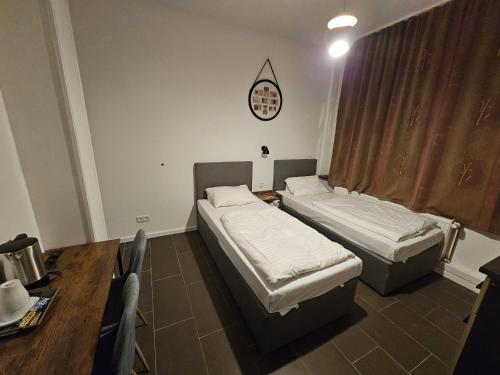 Ένα ή περισσότερα κρεβάτια σε δωμάτιο στο ApartHotel Slumber 24h Self Check in