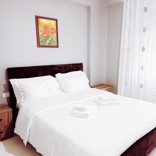 Ένα ή περισσότερα κρεβάτια σε δωμάτιο στο Sunset Residence Apartments