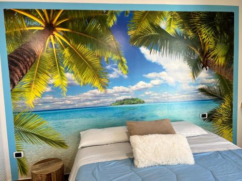 a bedroom with a mural of palm trees and the ocean at Pompei Sunday Estate Exclusive Apartaments in Pompei