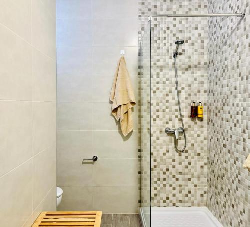 a bathroom with a shower with a glass door at Canaryislandshost l Girasol in Punta de Mujeres