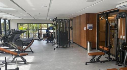 a gym with treadmills and exercise equipment in a room at Salinas Premium Resort in Salinópolis