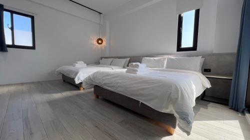 Una cama o camas en una habitación de 澎湖旅澄民宿 ph880Journey