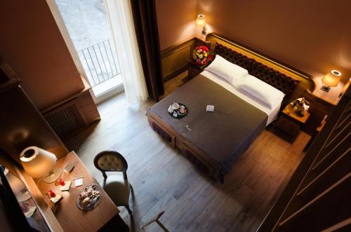 an overhead view of a bedroom with a bed and a table at Le Club Boutique Hotel in Lecce