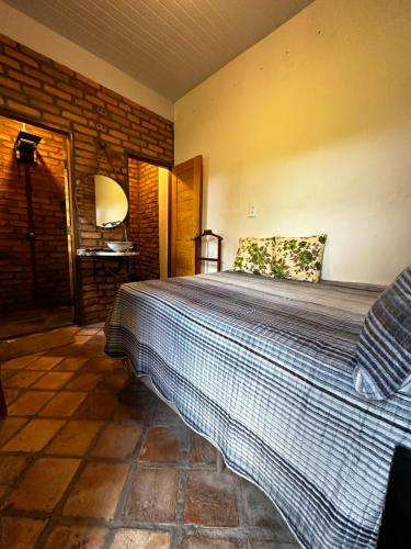 a bedroom with a large bed in a room at Casa da praia Atins Maranhão in Atins