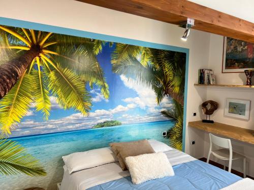 a bedroom with a mural of a palm tree and the ocean at Pompei Sunday Estate Exclusive Apartaments in Pompei