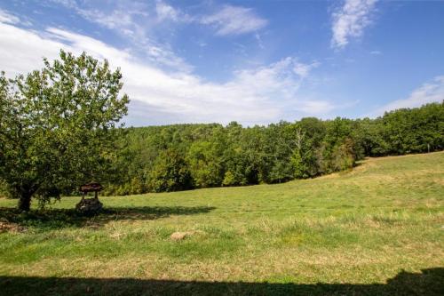 a park with a picnic table in a field at Gite lili in Blis-et-Born