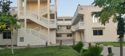 an external view of a building with stairs at SHIMBA SPRINGS MBUYU. ( Malindi) in Malindi