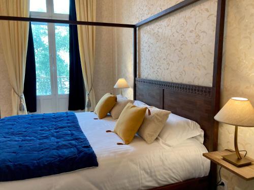 Ένα ή περισσότερα κρεβάτια σε δωμάτιο στο Le Clos du Roc